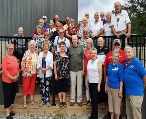 Group of people gathered together outside a building
